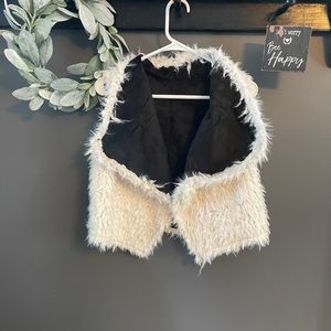 Reversible black and white vest.